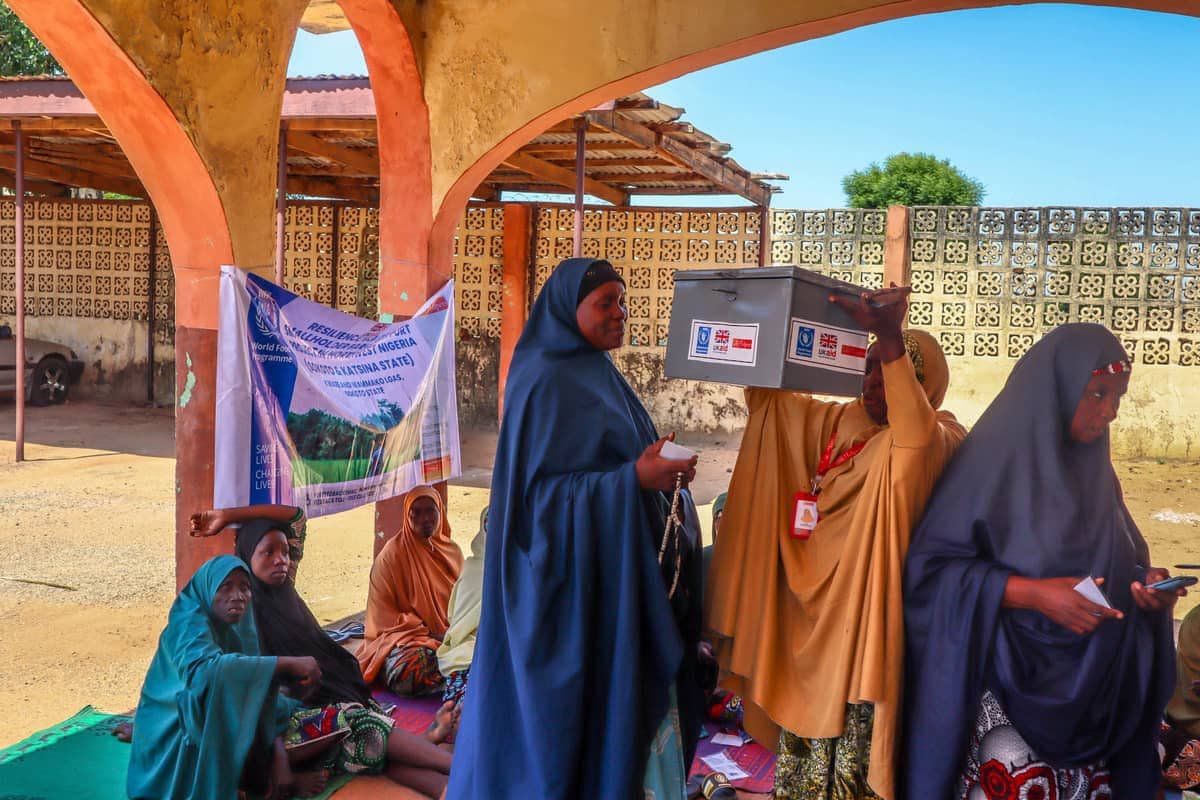 Women collecting kits at a community distribution